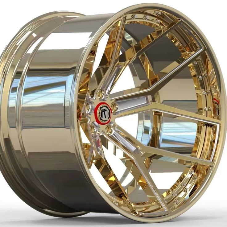 a gold wheel with chrome rims on a white background