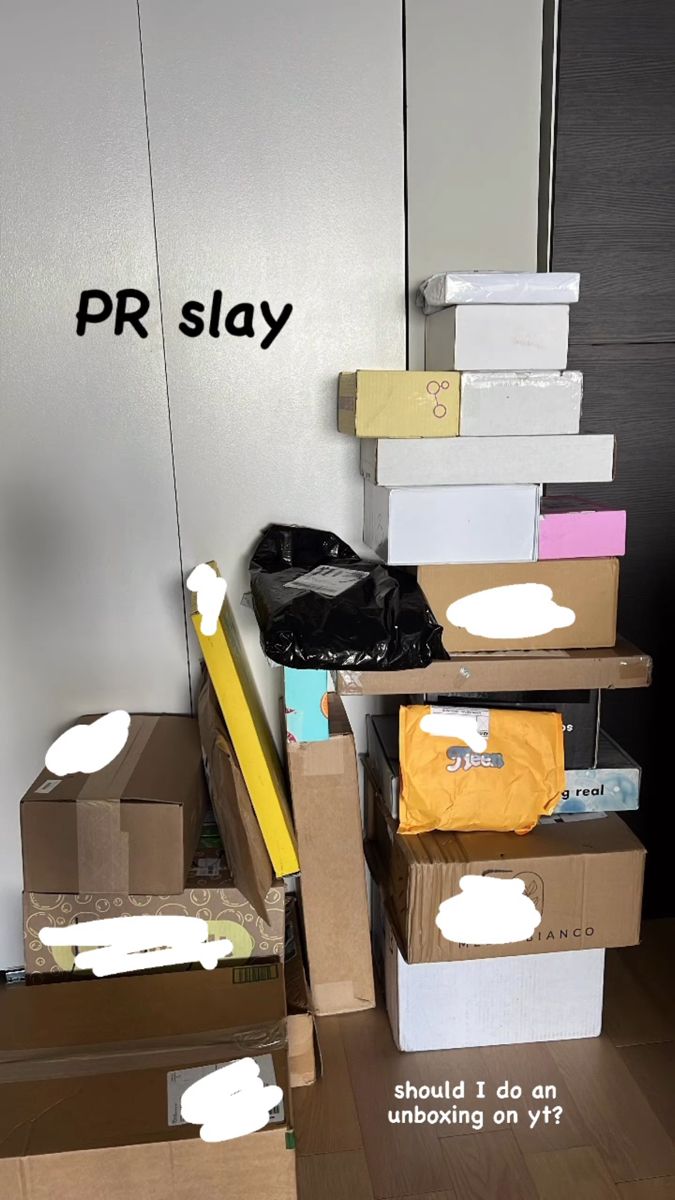 cardboard boxes stacked on top of each other with the words pr slay above them