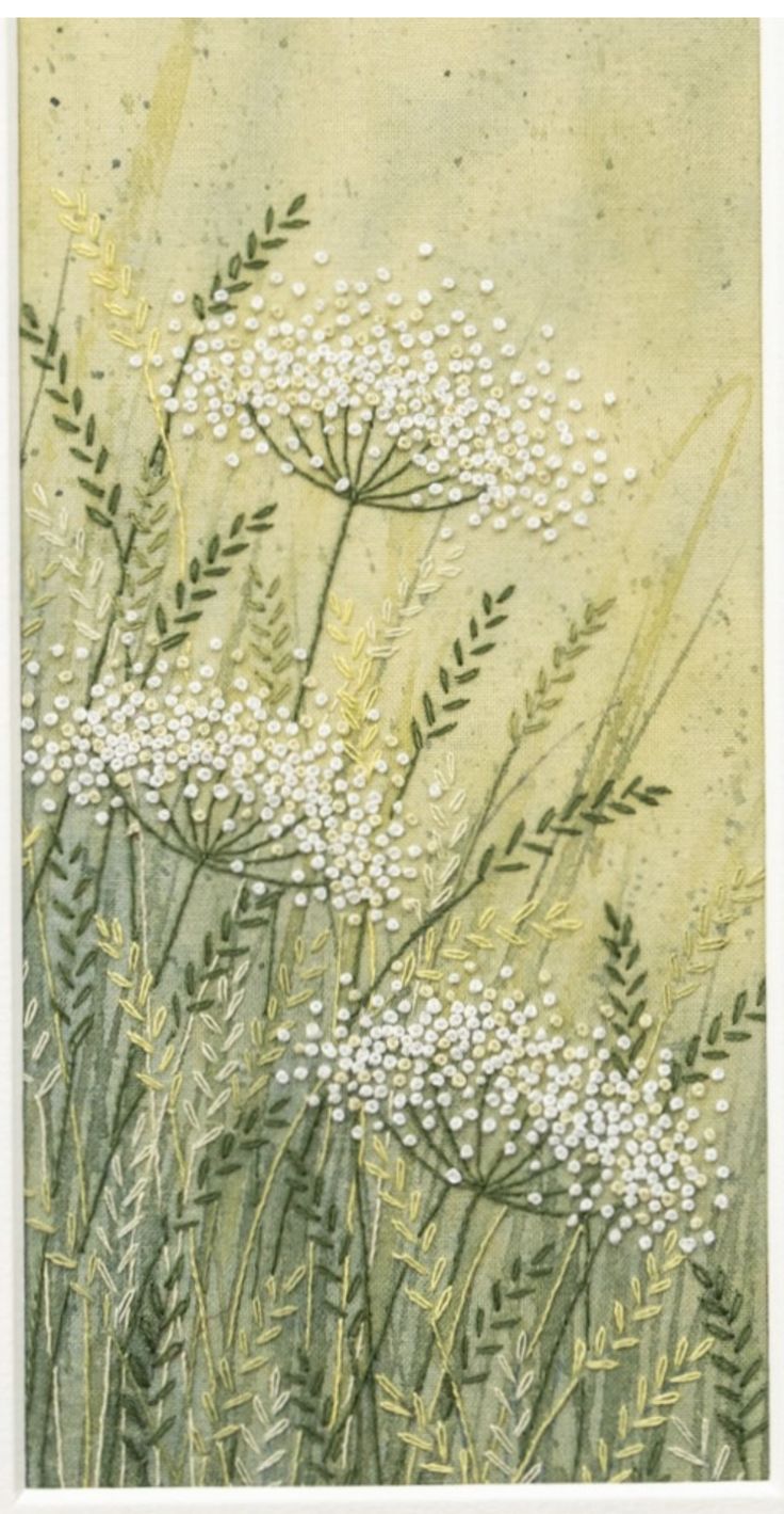 some white flowers and green grass on a yellow background