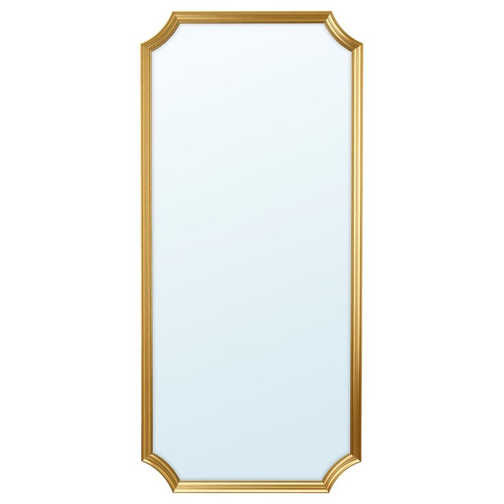 a gold framed mirror on a white wall