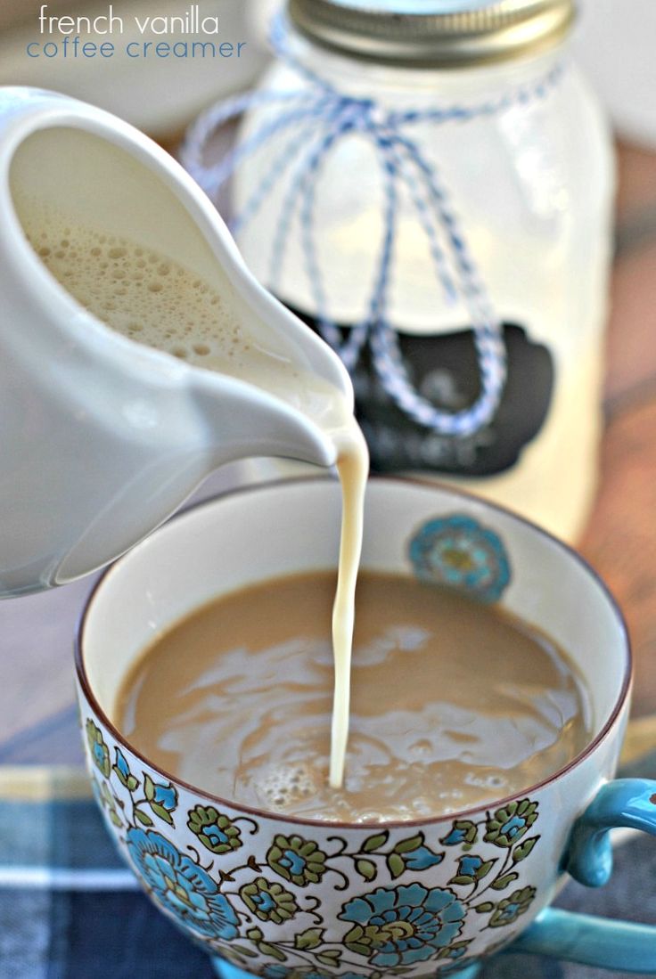 a cup of coffee being poured into it