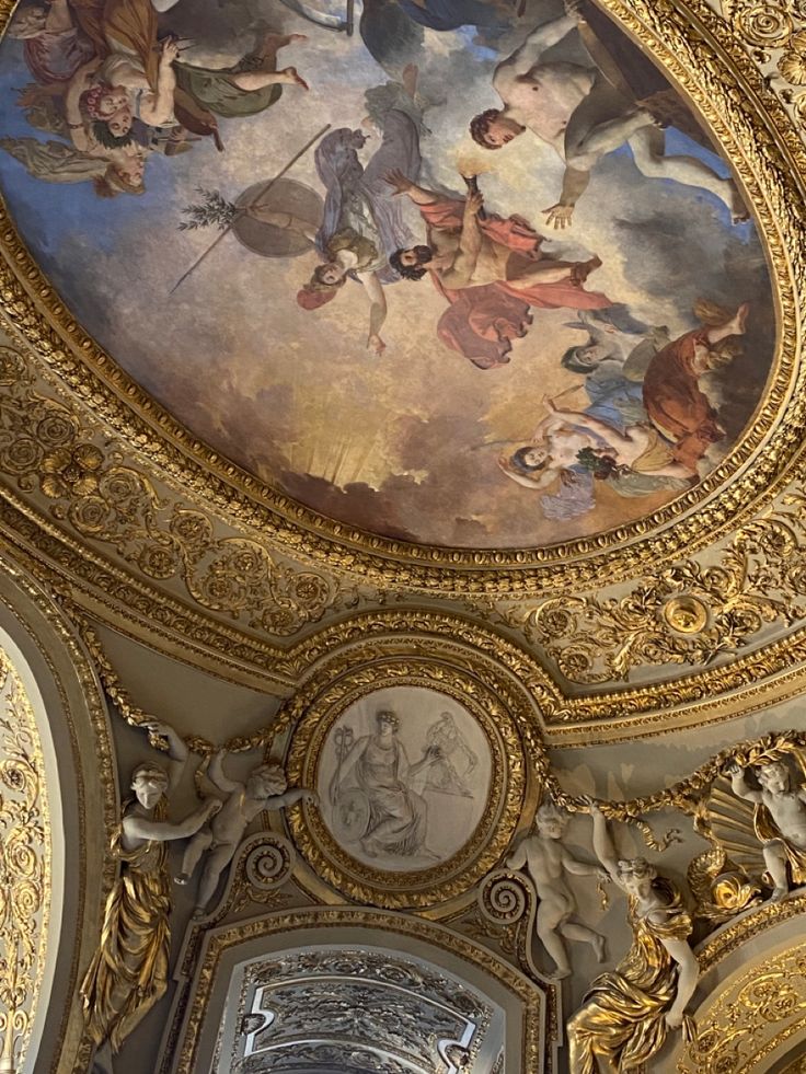 an ornate ceiling with paintings on it