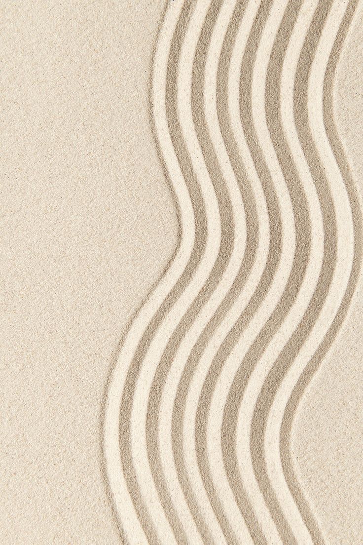 the sand has wavy lines drawn on it