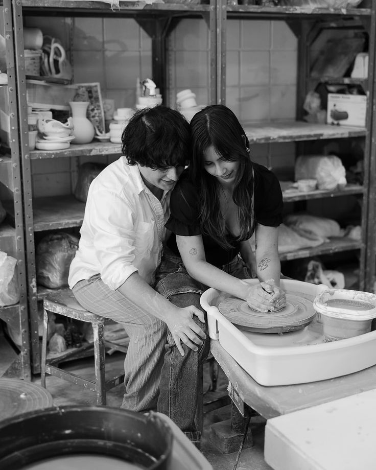 a man and woman are making bread together