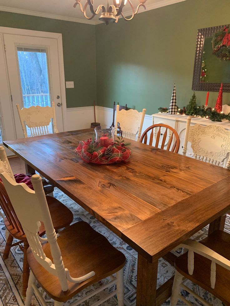 a wooden table with chairs around it