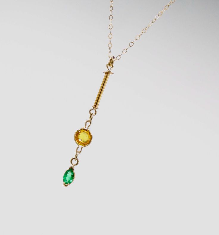 This is a truly unique and wonderful Minimalist 14k gold necklace with a 14k solid yellow gold dainty 1mm cable chain and a high quality Colombian natural emerald pendant with a natural citrine gem of great quality. The high quality natural vibrant green emerald marquise gem measures 5x3mm and is set in a solid gold bezel. The beautiful deep yellow brilliant cut round 5mm citrine is also set in a 14k solid gold light bezel and accompanies the 12mm long 14k solid gold tube that makes this necklac Minimalist Gold Emerald Gemstone Necklace, Modern Emerald Jewelry In Yellow Gold, Modern Yellow Gold Emerald Jewelry, Elegant Green Citrine Jewelry, Minimalist Gold Emerald Necklace In Sterling Silver, Gold Emerald Birthstone Necklace In Minimalist Style, Gold Minimalist Emerald Birthstone Necklace, Minimalist Gold Emerald Birthstone Necklace, Minimalist Emerald Necklace In Yellow Gold