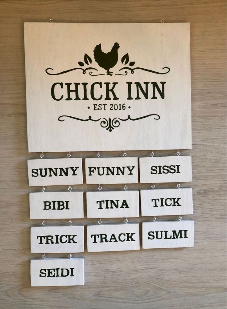 the chicken inn sign is hanging on the wall next to several pieces of wood that spell out their names