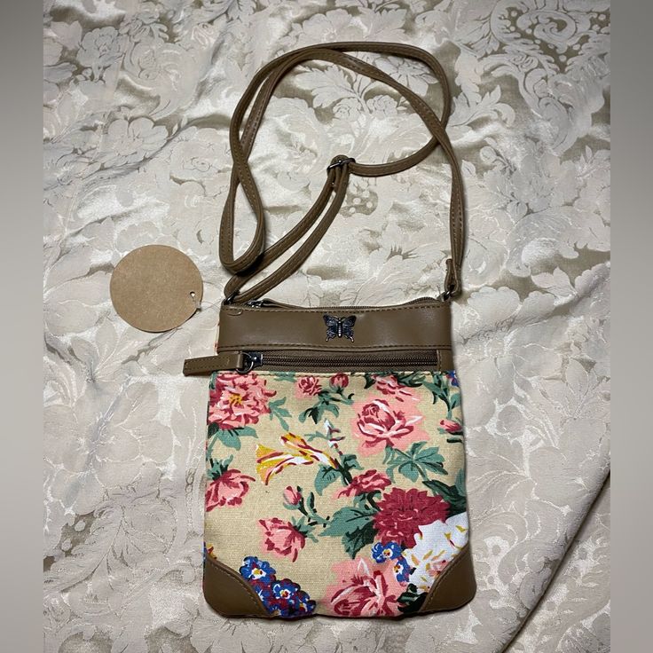 This Bag Is Very Cute And Small Great For Travel Casual Beige Shoulder Bag With Floral Print, Spring Phone Bag With Adjustable Strap For Daily Use, Beige Floral Print Shoulder Bag For Daily Use, Casual Floral Print Flower Shoulder Bag, Beige Floral Print Satchel Shoulder Bag, Beige Floral Print Shoulder Bag For Everyday Use, Beige Floral Print Shoulder Bag For Travel, Spring Floral Print Shoulder Bag For Everyday Use, Spring Floral Print Shoulder Bag