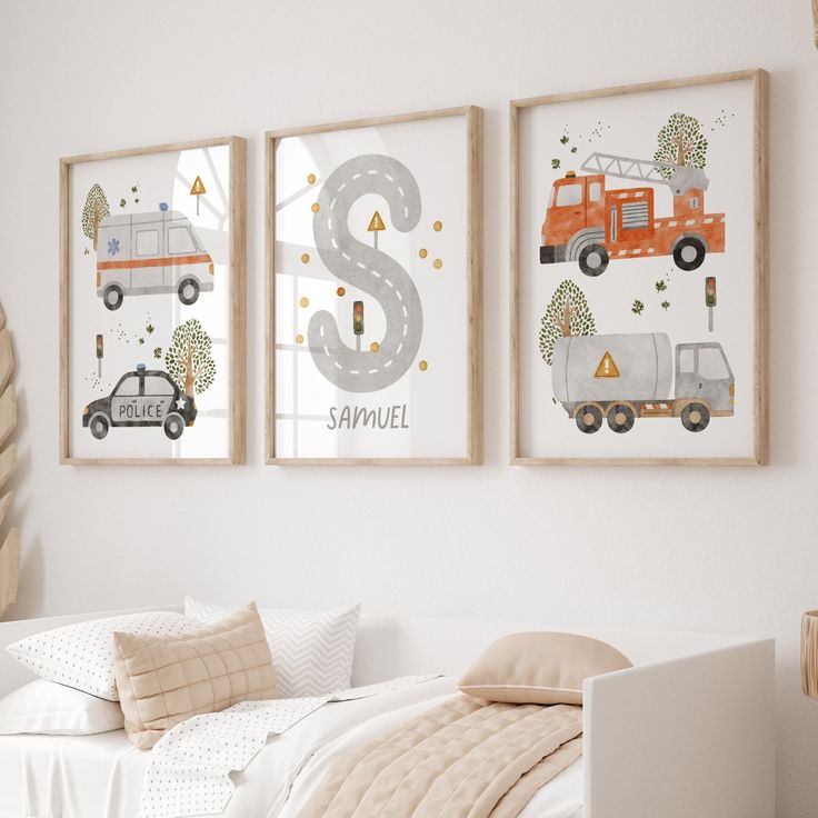 two framed pictures hang on the wall above a bed in a child's bedroom