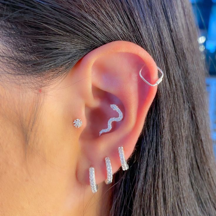 a woman with ear piercings on her ears