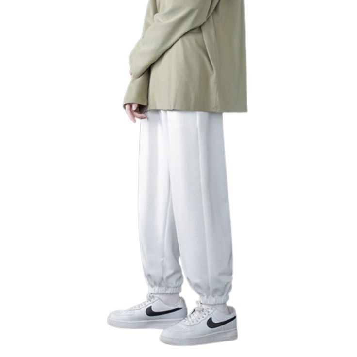 The Baggy Wide Leg Casual Sweatpants are the ideal winter companion for men who want functionality and flair in their wardrobe. Made from high-quality fabrics, these pants offer a comfortable and toasty fit, making them suitable for the chilly season. But that's not all! You won't ever have to worry about carrying your essentials separately because of the numerous compartments that were thoughtfully positioned throughout the design. Specifications: Applicable Season: Spring and Autumn Applicable Winter Streetwear Parachute Pants With Elastic Waistband, Casual Winter Leisure Bottoms, Winter Parachute Pants With Elastic Waistband For Streetwear, Solid Color Leisure Pants For Fall, Winter Solid Color Full-length Cargo Pants, Winter Full-length Solid Cargo Pants, Full Length Bottoms For Leisure In Winter, Winter Full Length Bottoms For Leisure, White Baggy Pants For Winter