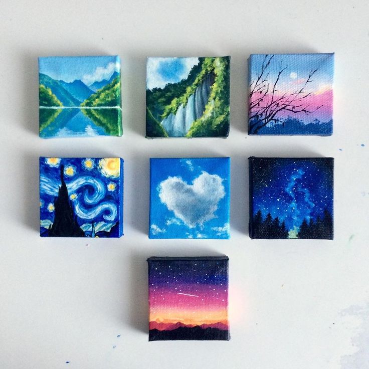 six square paintings are arranged on a white surface