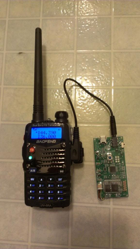 a small radio sitting on top of a white tiled floor