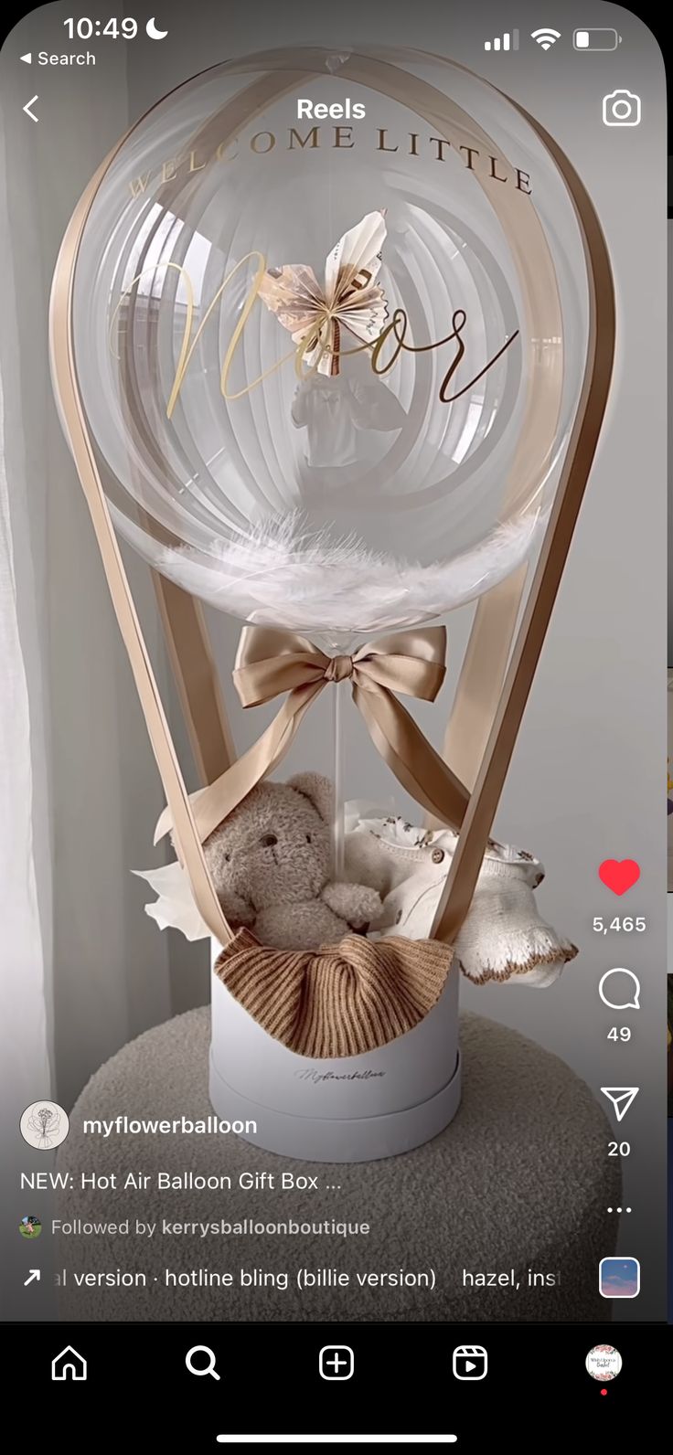 an image of a gift box with a teddy bear in it on the phone screen