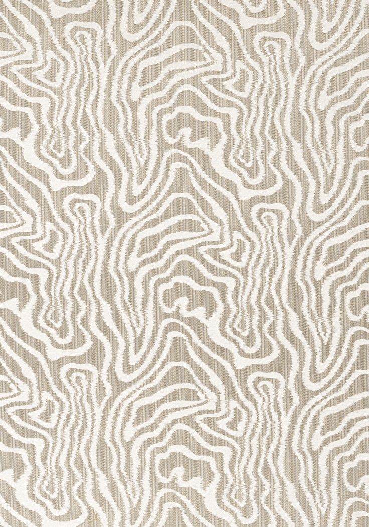 a beige and white rug with wavy lines on it