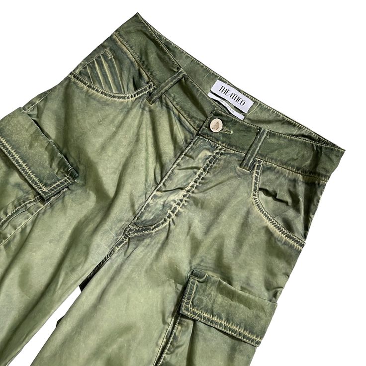 THE ATTICO Fern Long Pant in Military GreenSize 36IT // US XXSmallColor Wash Green Preloved **Fading and blemishes of color are part of these pants' style.**Please check measurements and brand size chart before purchasing.**Both sides of the pants had loose threads and were professionally repaired. Please take a look at pictures number 4 and 5.Approx. Measurements Inseam 34.5"Waist 14.5"Hips 17.5"Rise 11"Website DetailsSelf: 100% polyesterLining: 100% cotton. Made in Italy. Hand wash. Zip fly wi Green Pants With Hip Pockets For Spring, Green Wide Leg Pants With Five Pockets, Fitted Tapered Leg Parachute Pants For Spring, Green Tapered Leg Pants With Hip Pockets, Green Straight Pants With Five Pockets, Spring Green Pants With Hip Pockets, Green Cargo Straight Pants, High Waist Cargo Pants With Five Pockets For Summer, Fitted Wide Leg Bottoms With Cargo Pockets