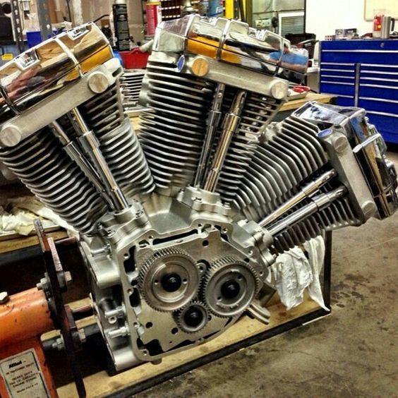 a motorcycle engine sitting on top of a wooden pallet