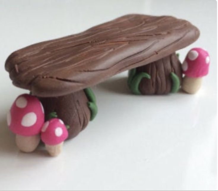 a toy bench made out of chocolate and mushrooms