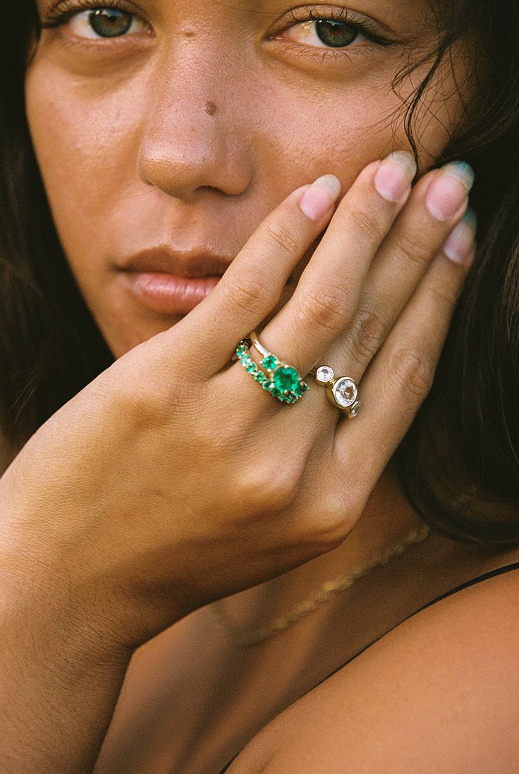 a close up of a person wearing a ring