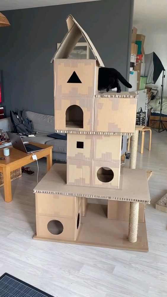 a cat house made out of cardboard boxes