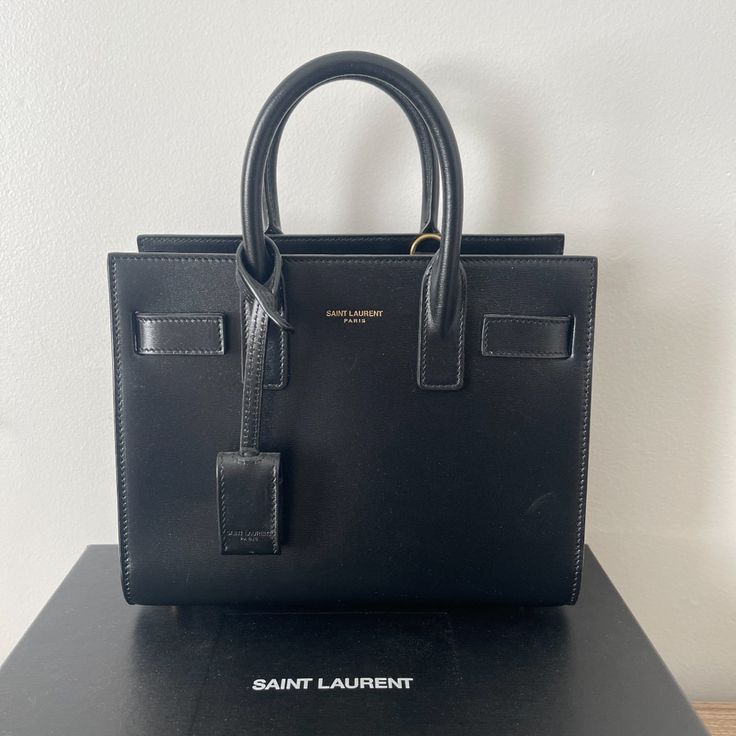 Saint Laurent Handbag Black Never Worn!! Have Dust Bag And Box ! High-end Square Bags With Branded Hardware, Designer Everyday Luxury Box Bag With Top Handle, Designer Box Bag With Top Handle For Everyday Luxury, Luxury Square Box Bag For Shopping, Modern Square Bags With Branded Hardware, Modern Square Bag With Branded Hardware, Light Luxury Everyday Rectangular Bag, Classic Rectangular Bags With Branded Hardware, Classic Rectangular Bag With Branded Hardware