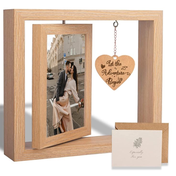 a wooden photo frame with a heart hanging from it and a card attached to the front