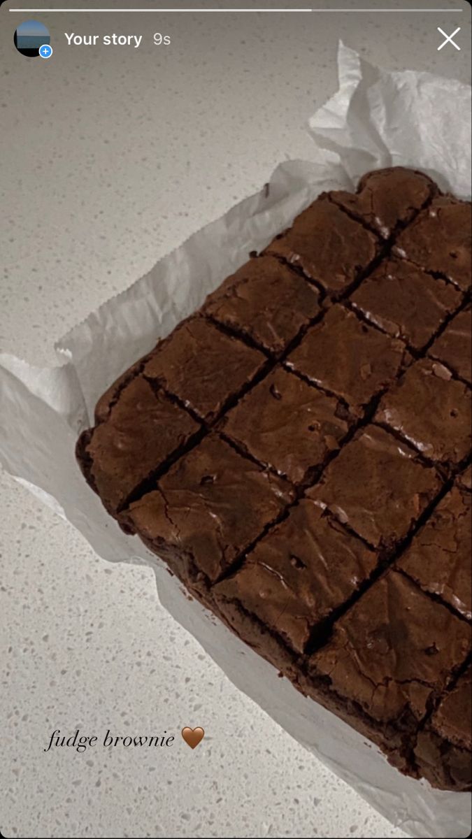 a brownie sitting on top of a piece of wax paper