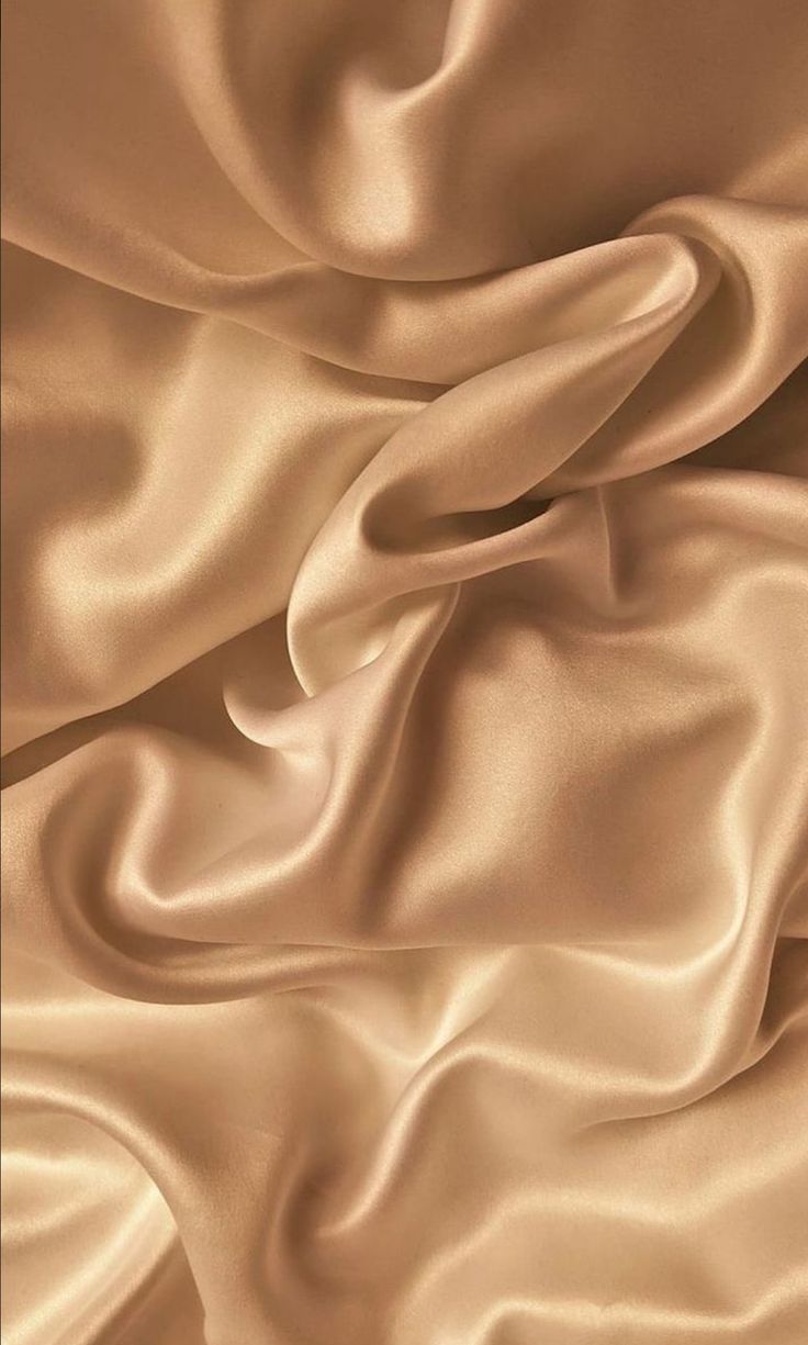 a close up view of a tan silk fabric