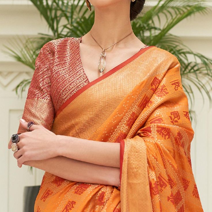 Orange colored saree is prettified with weaving patola work as shown which makes it appear classy. This saree is made of art silk fabric which is accompanied with art silk blouse piece which you can customise as per your design/style. Women can buy this saree to wear for their festive, sangeet and homely events and ideal for any fashionista. Note:- The actual product may differ slightly in color and design from the one illustrated in the images when compared with computer or mobile screen. Patola Silk Saree, Latest Sarees, Printed Saree, Chiffon Saree, Georgette Sarees, Printed Sarees, Womens Clothing Stores, Saree Collection, Desi Beauty