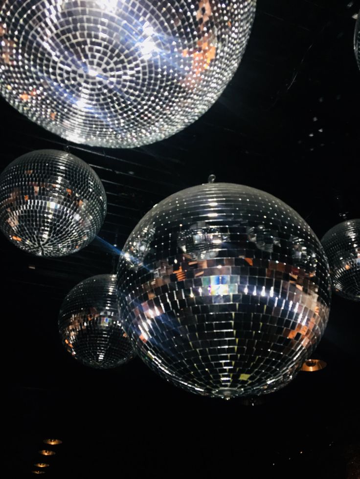 shiny disco balls hanging from the ceiling