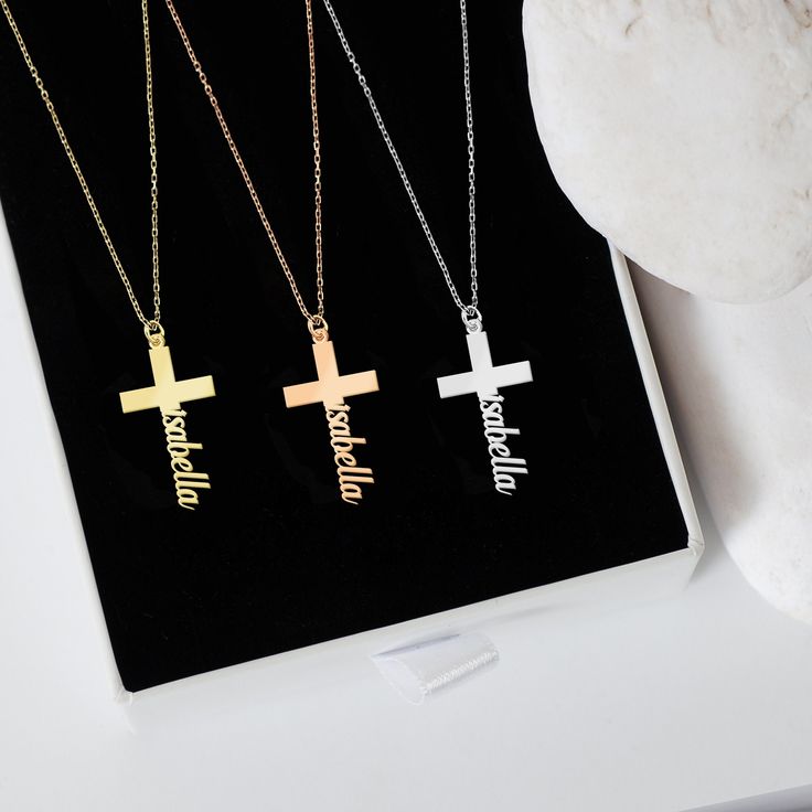 "Discover the elegance of our 14K Solid Gold Cross Necklace, thoughtfully designed to add a personalized touch. Through its unique craftsmanship, your precious name takes a graceful position at the cross's pinnacle. As a Tiny Cross Necklace, it emerges as a heartfelt gift, echoing sentiments of love, devotion, and individual essence. PRODUCT DETAILS * Material: 14K Solid Gold (real solid gold, no gold-filled or no gold plated material) * Choice of Gold Color: Yellow Gold, Rose Gold, White Gold * Closure: Spring ring * Chain style: Cable * Style: Minimalist Thinking of gifting? Elevate your order with our Christmas Gift Wrap option! 🎁 Buy from here! https://www.etsy.com/listing/1580219719/ M O R E F R O M U S Mionza Jewels' pieces are handcrafted by 30 years of experienced craftsmen and ma Affordable Personalized Cross Necklace Gift, Classic Name Necklaces For Gifts, Classic Customizable Necklaces For Birthdays, Customizable Classic Necklace For Birthday, Classic Customizable Necklace For Birthday, Custom Name Necklace In White Gold, Personalized Cross Necklace In Gold, Custom Name White Gold Necklace For Gift, Gold Cross Necklace For Personalized Gift