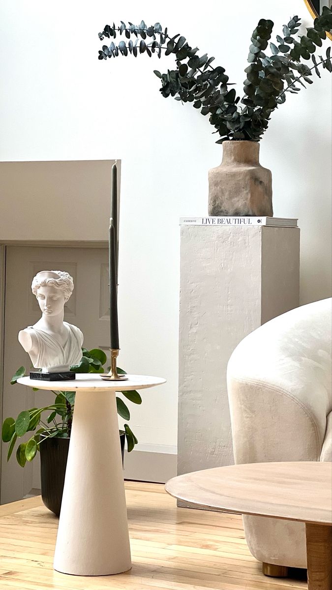 Pedestal table with marble top, pedestal cube with vase of eucalyptus Pedestal In Living Room, Pedestal Living Room Decor, Marble Side Table Diy, How To Make A Pedestal, Round Marble Side Table, Diy Plaster Side Table, Round Pedestal Side Table, Diy Cement Side Table, Pedestal Side Table Bedroom