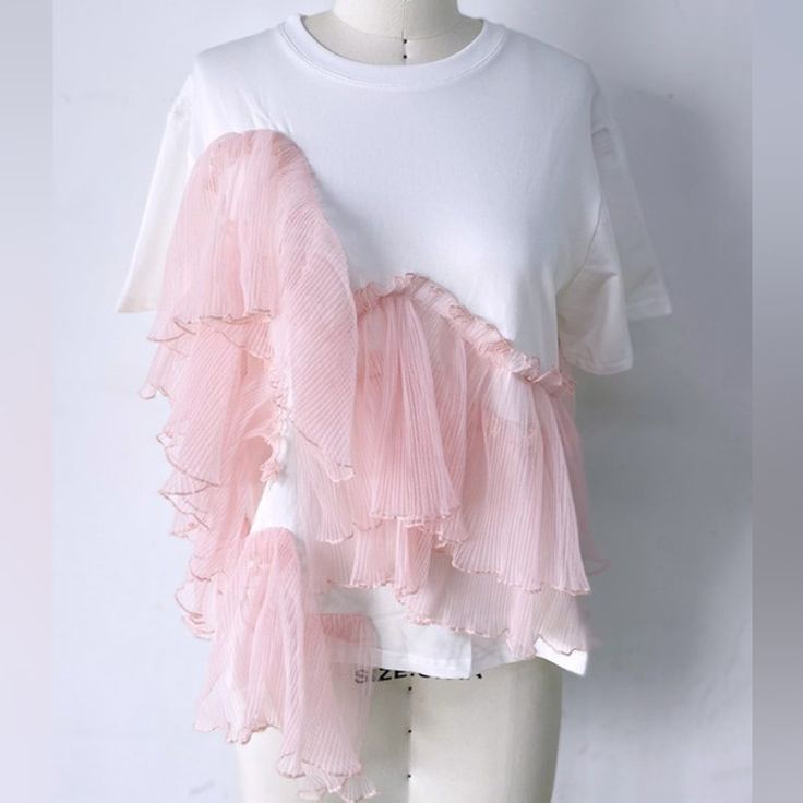 Dress Up Your Casual Look With This Ruffled Chiffon Tee Shirt Top! Oversized Fit, Short Sleeve Tee, Lace Ruffle Detail Slightly Cropped And Side Slits At Bottom Hem Asymmetrical Ruffle Layers, Plenty Of Stretch Available In Black With Black Lace Or White With Pink Lace White Ruffled Crew Neck T-shirt, Trendy Ruffled T-shirt For Summer, Trendy Summer Ruffled T-shirt, Trendy Summer T-shirt With Ruffles, White Ruffled Short Sleeve T-shirt, Spring Ruffle Sleeve Top For Layering, Pink Ruffled T-shirt For Spring, Ruffle Sleeve Tops For Summer Layering, Trendy Ruffled T-shirt For Spring