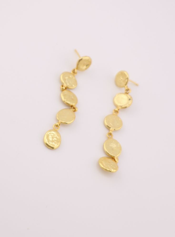 Indulge in opulent elegance with our Golden Dot Earrings. Handcrafted in Jaipur, India and plated with 24k gold, these earrings are the epitome of luxury. A perfect addition to any outfit, these earrings are a testament to the artistry of Indian craftsmanship. Gold Plated Bridal Earrings, Gold-plated Bridal Earrings, Hammered Gold Plated Earrings For Wedding, Hammered Gold Plated Wedding Earrings, Hammered Gold-plated Earrings For Wedding, 22k Gold Drop Chandelier Earrings As Gift, Yellow Gold Drop Earrings With Plating, Elegant 22k Gold Chandelier Earrings Gift, Elegant 22k Gold Single Earring