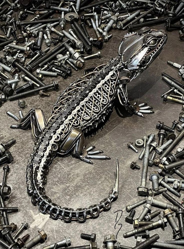 a lizard is surrounded by lots of screws