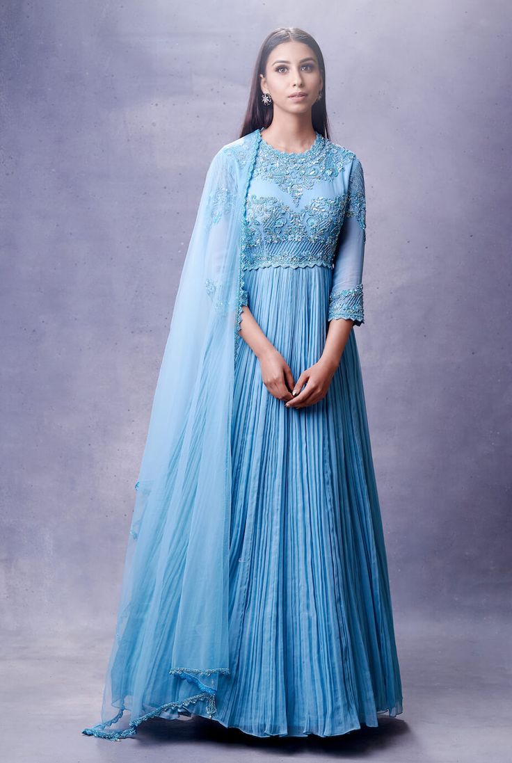 Editor's Note Hand Embroidered Ice Blue Anarkali Set With Same Color Hand Embroidered Dupatta. Color: Blue Fabric: Georgette Care: Dry Clean Only About the Designer Aman Takyar, coveted for bridal couture, handcrafted luxury pret, derives inspiration from the splendid crafts and heritage of India. Blue Anarkali, Blouse Yoke, Embroidered Neckline, Cut Work, Anarkali, Bridal Couture, Three Quarter, Ice Blue, Festival Wear