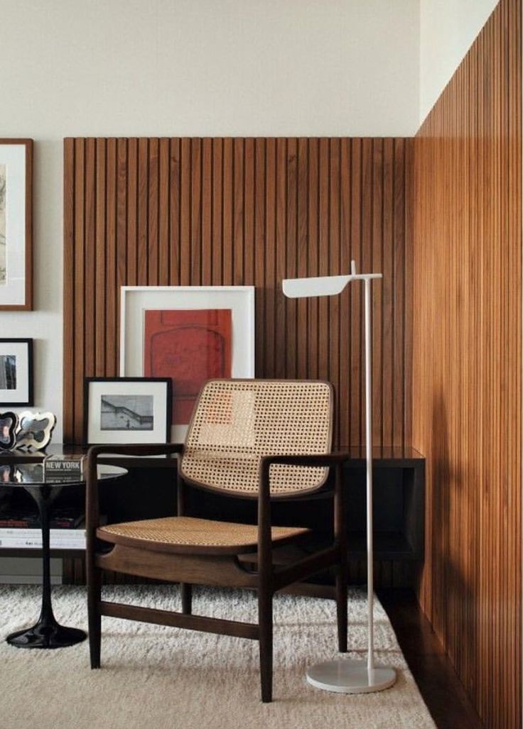 a living room filled with furniture and pictures on the wall