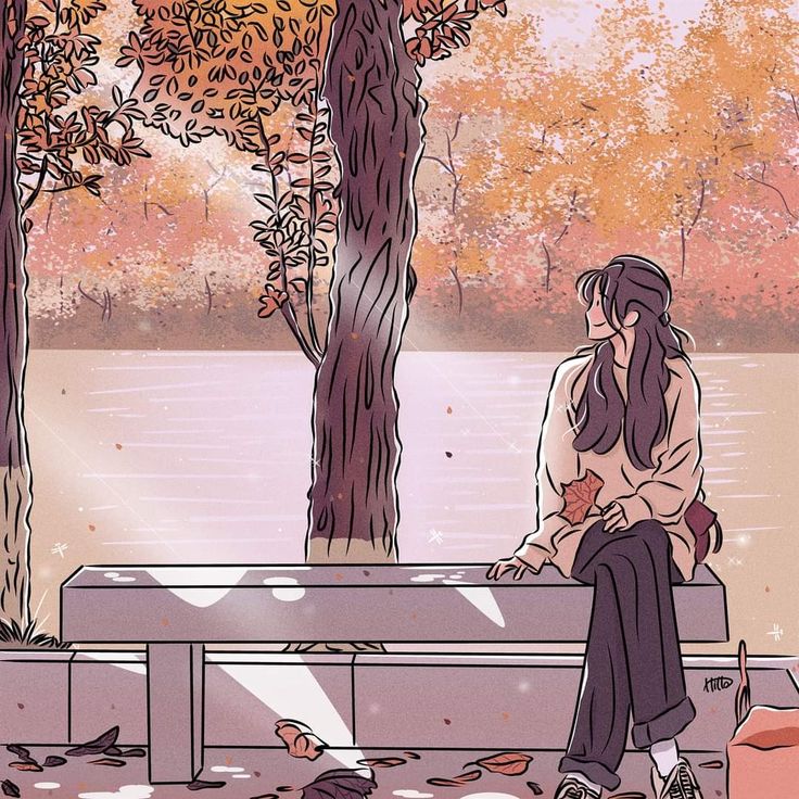 a woman sitting on a bench next to a tree