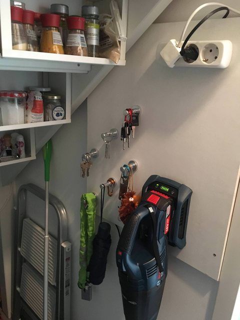 there are many tools hanging on the wall next to each other in this small room