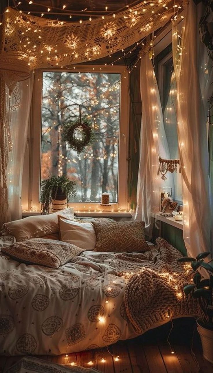 a bedroom with lights strung from the ceiling and curtains on the window sill over the bed