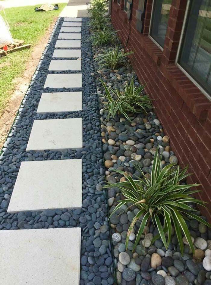 a walkway made out of rocks and gravel