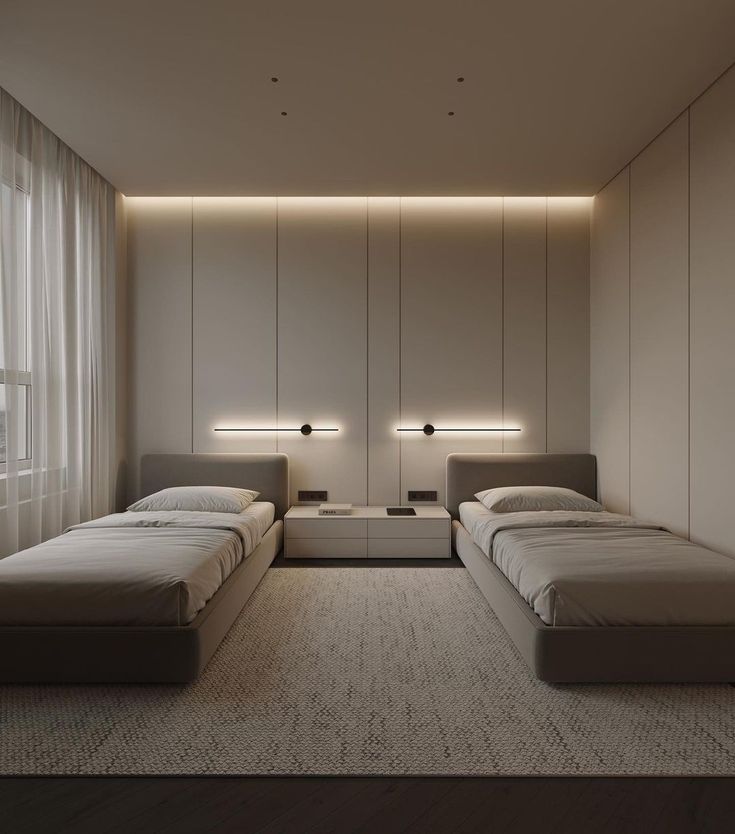 a bed room with two beds sitting next to each other