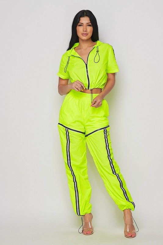 Our Two Ways Reflective tracksuit featuring Crop Jacket. Turn track Pants Into Shorts By Removing Zipper Flash Reflective Detail. Wear Two Ways. Neon Yellow. Reflective Tracksuit, Pants Into Shorts, Yellow Tracksuit, Sweat Suits Outfits, Crop Jacket, The Flash, Neon Yellow, Track Pants, Two Piece Pant Set