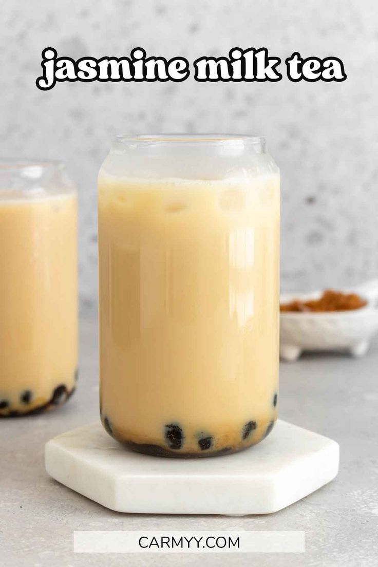 two jars filled with pudding sitting on top of a counter