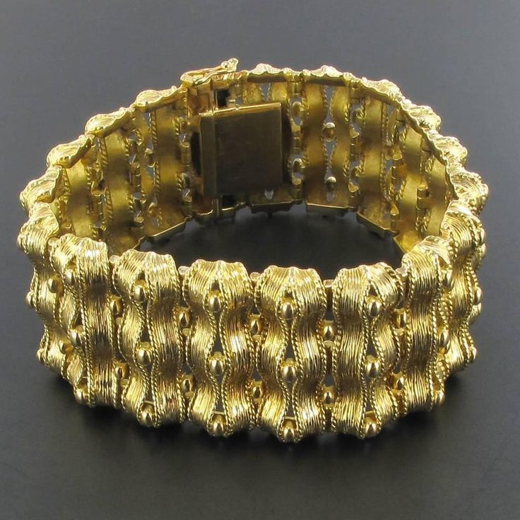 This is part of Chairish’s Fine Jewelry assortment.  18 carat yellow gold bracelet, rhinoceros head hallmark.  Fully articulated, this splendid bracelet is formed of articulated motifs made of ribbons of chiseled gold spaced with small golden pearls.  The clasp is with 8 safety.  Length: 18.5 cm, width at widest: 2.7 cm, thickness at widest: 5.9 mm.  Total weight of the bracelet: 71.2 g approximately.  Authentic antique jewel-French work from the end of the 19th century.  Our opinion: Rare of th Ribbon Bracelet, Ribbon Bracelets, Gold Ribbon, Gold Ribbons, Yellow Gold Bracelet, Cartier Ring, Vintage Cartier Bracelet, Dior Ring, Vintage Cartier