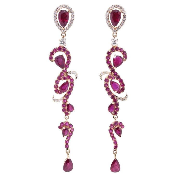 These exquisite Ruby Drop Dangle Earrings are a true statement of luxury and grace. The intricate design, set in 18k rose gold, features a brilliant combination of 84 sparkling diamonds and 54 vibrant rubies, making them the perfect blend of elegance and boldness. Elevate your style with these earrings that capture attention effortlessly. Earring Information Diamond Type : Natural Diamond Metal : 18k Metal Color : Rose Gold Number of Diamonds : 84 Number of Rubies : 54 Total Gold Weight : 6.96 g Elegant Ruby Bridal Earrings For Party, Elegant Rose Red Earrings For Party, Red Diamond Earrings For Party, Red Diamond Party Earrings, Elegant Rose Red Dangle Jewelry, Jewelry Ruby, Gold Number, Drop Dangle Earrings, Design Set