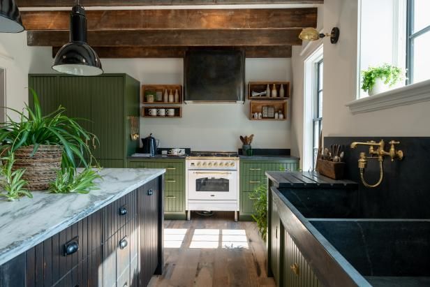 a kitchen with green cabinets and white stove top oven next to a wooden countertop