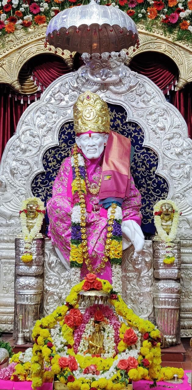 the statue is decorated with flowers and other decorations