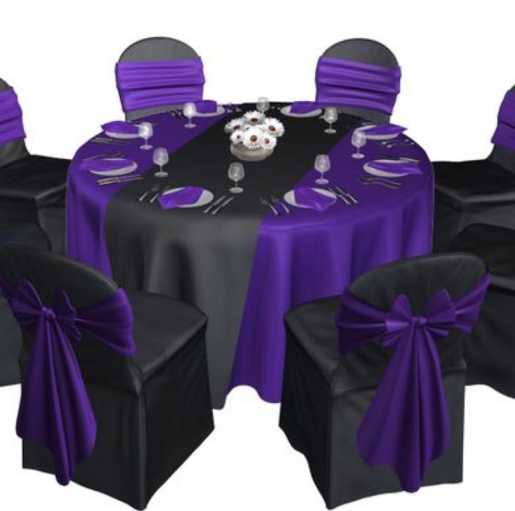 the table is set with black and purple cloths