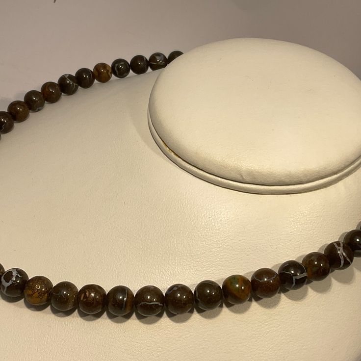 Introducing our exquisite Boulder Opal Beads Necklace, a true masterpiece of nature's artistry. Crafted with meticulous attention to detail, this stunning necklace showcases the mesmerizing beauty of Australian Natural Boulder Opal. Featuring a generous total weight of 225.85 carats, this necklace is adorned with beads ranging in size from 8.55 mm to 8.60 mm, arranged in perfect sequence to create an alluring composition. Each bead is a testament to the opal's enchanting allure, with vibrant col Opal Beaded Necklaces With Round Beads, Opal Beads Necklace, Opal Rondelle Bead Necklace, Adjustable Opal Bead Necklaces, Boulder Opal Necklace, Boulder Opal, Stunning Necklace, Patterns In Nature, Bouldering